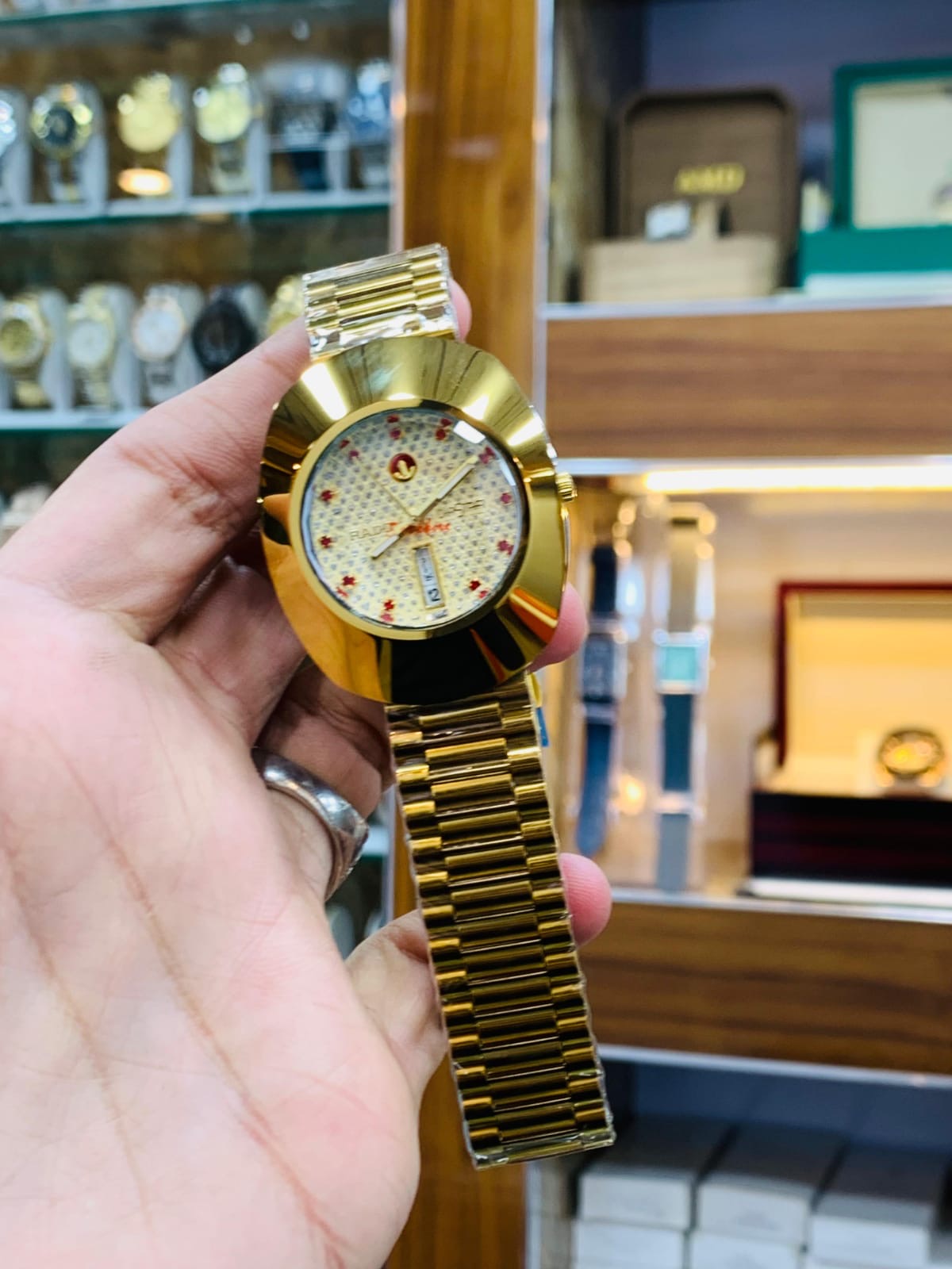 Rado DiaStar featuring a distinct oval case and a checkered dial pattern