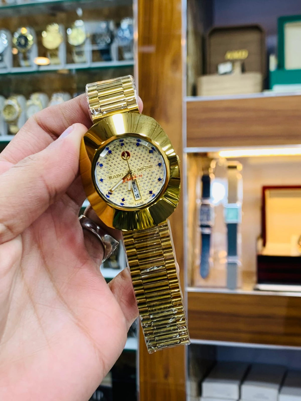 Rado DiaStar featuring a distinct oval case and a checkered dial pattern