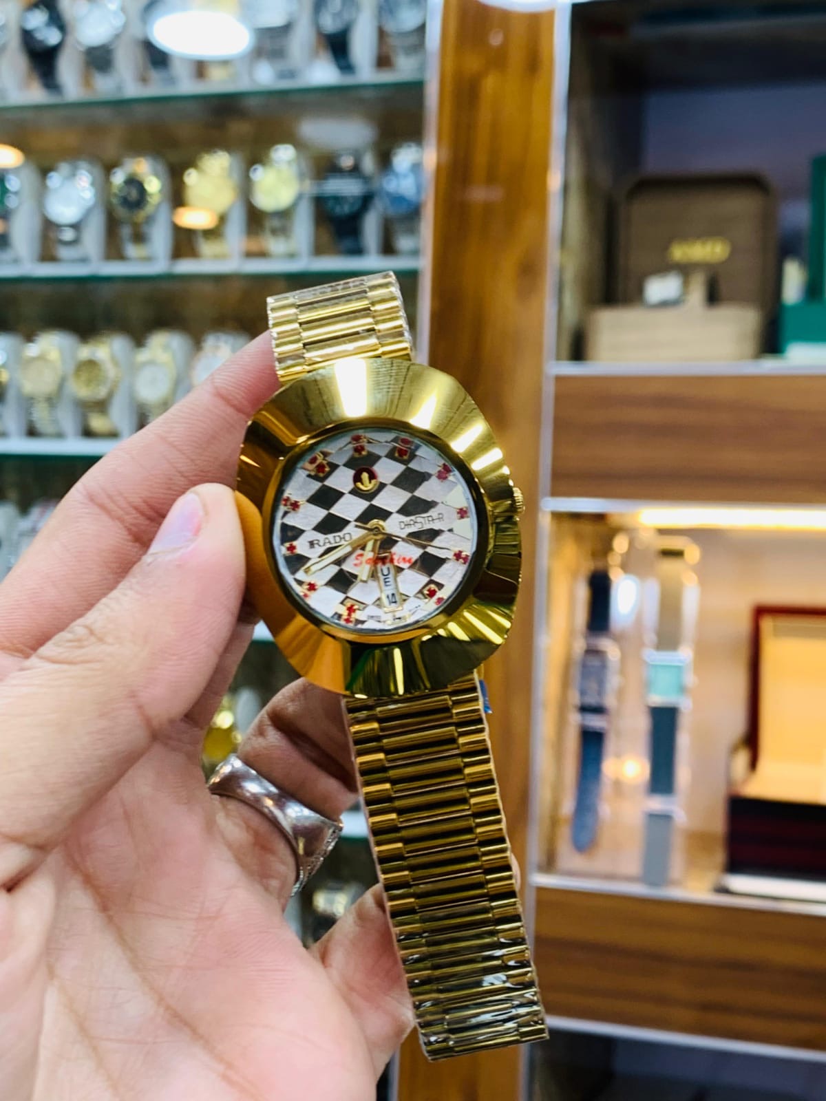 Rado DiaStar featuring a distinct oval case and a checkered dial pattern