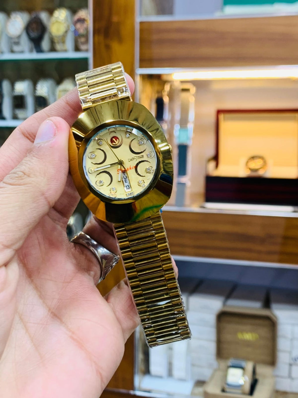 Rado DiaStar featuring a distinct oval case and a checkered dial pattern